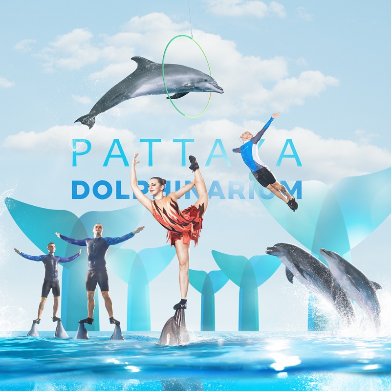 dolphinarium pattaya with dancer and dolphin striking a pose in the middle