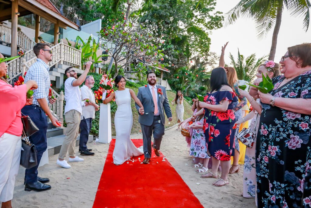 Couple walking down the aisle after a Christian wedding ceremony