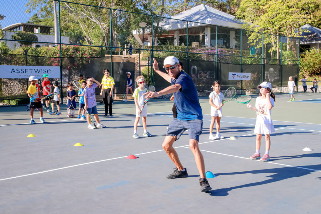 tennis coach training young players for our junior tennis championship