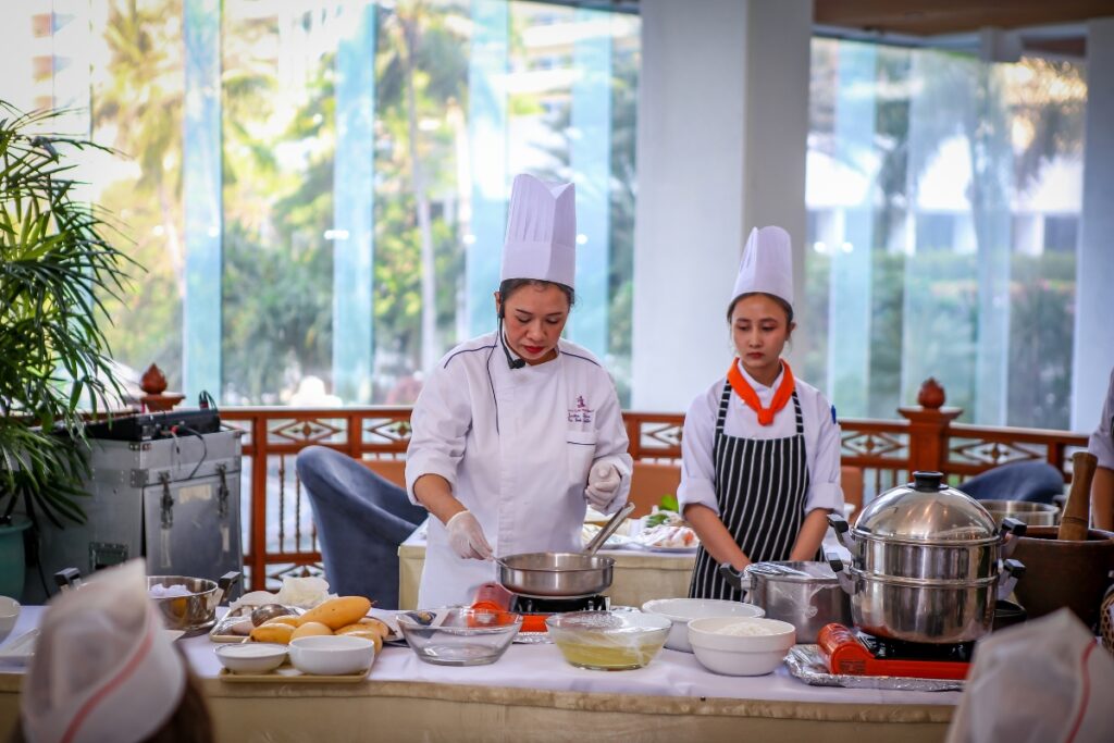 award-winning chef teaching how to make thai food in thai cooking course
